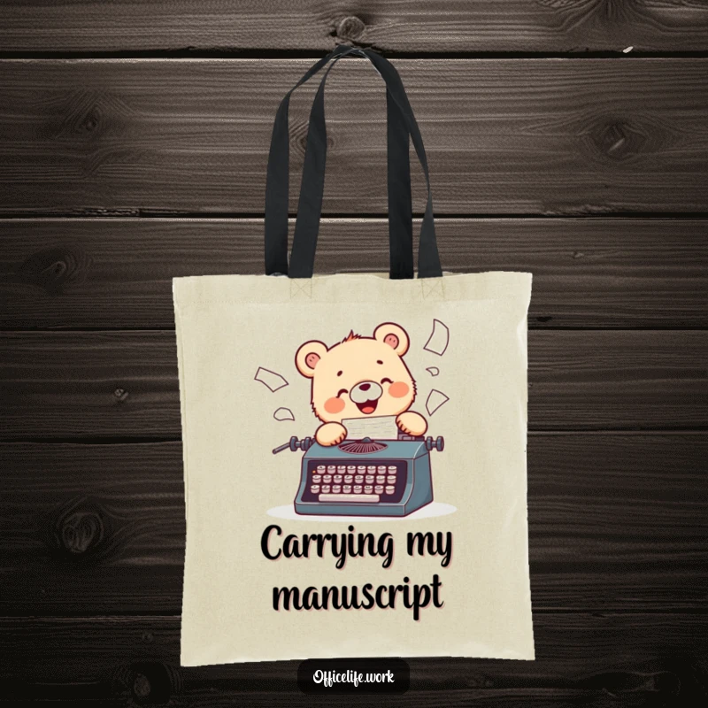 Funny tote bag featuring a cheerful bear cub enthusiastically typing on a vintage typewriter, papers flying.